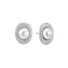 Oval rhodium-plated silver studs featuring freshwater pearls surrounded by pavé crystal halo on white background