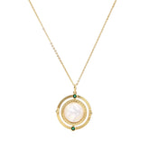 Gold pendant necklace with circular orbital design, iridescent mother-of-pearl center, and green zirconia accents