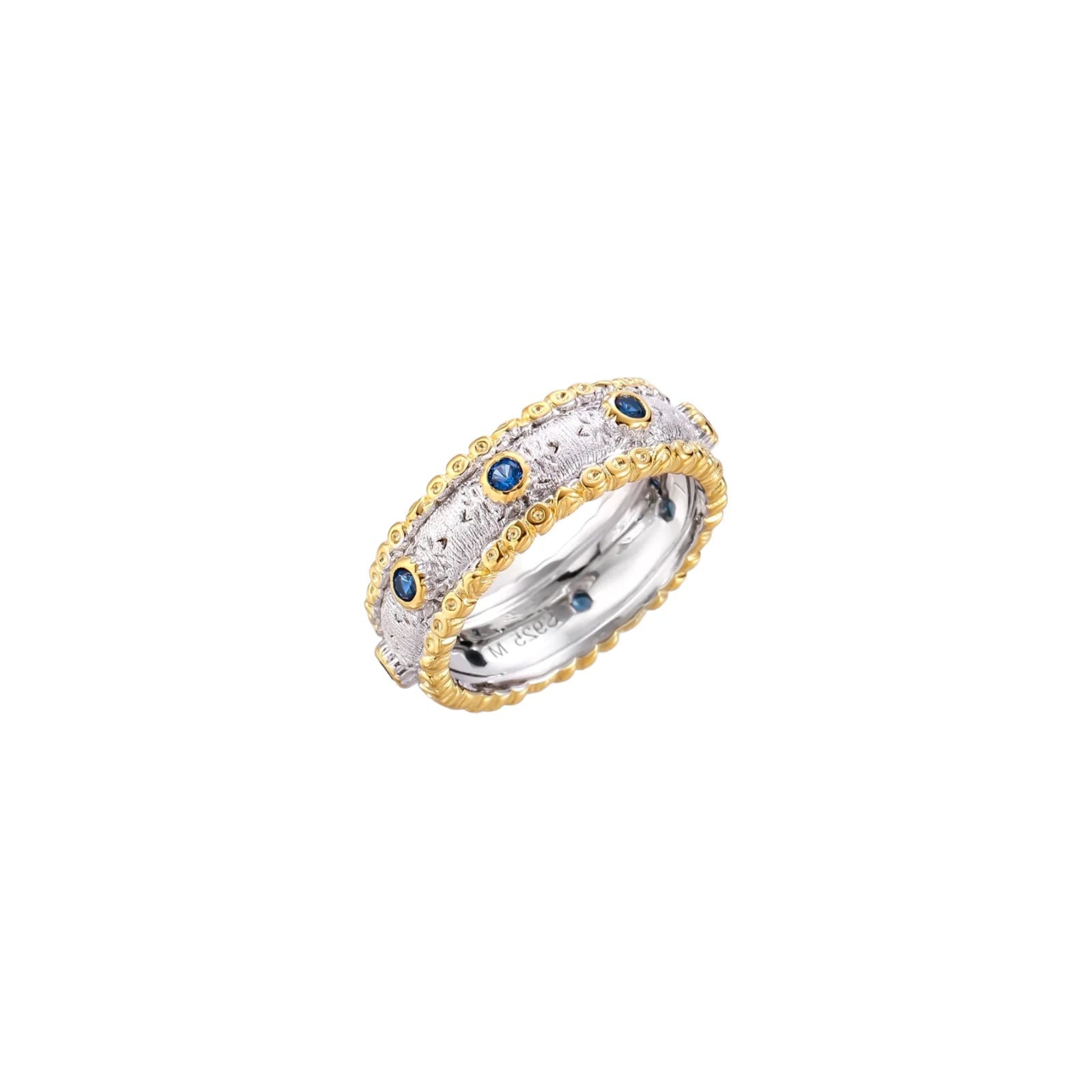 Two-tone ring with brushed silver center, gold beaded edges, and blue zirconia stones on white background.