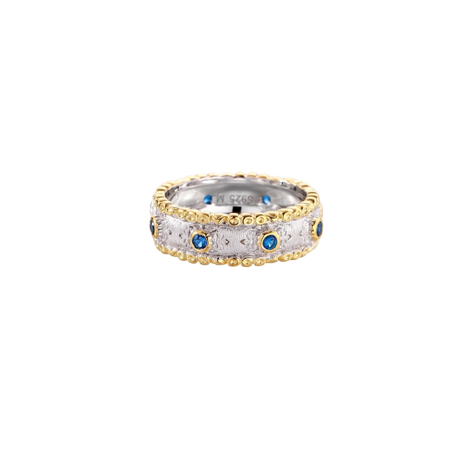 Two-tone ring with brushed silver center, gold beaded edges, and blue zirconia stones on white background.