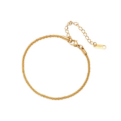 Delicate 18K gold-plated stainless steel bracelet with textured beaded chain on cream background