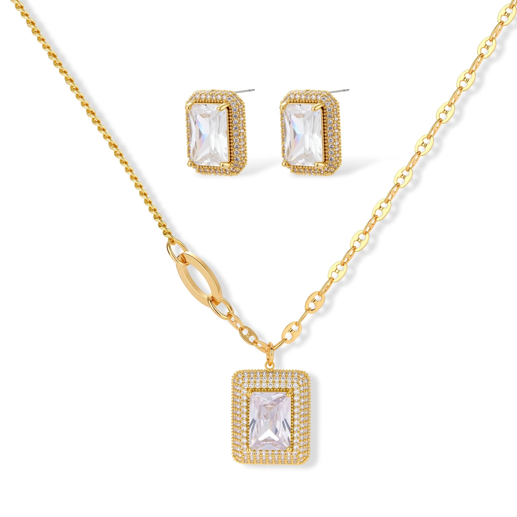 Gold-plated jewelry set with rectangular cubic zirconia stones in pave halo settings on cream background