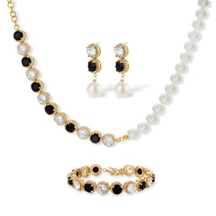 Gold-plated jewelry set with alternating black and clear cubic zirconia stones, featuring necklace, earrings and bracelet