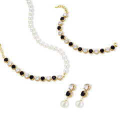 Gold-plated jewelry set with alternating black and clear cubic zirconia stones, featuring necklace, earrings and bracelet