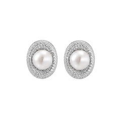 Oval rhodium-plated silver studs featuring freshwater pearls surrounded by pavé crystal halo on white background