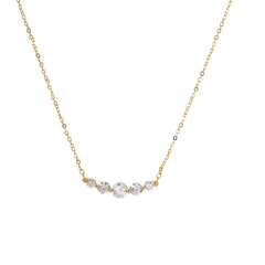Delicate 14K gold-plated necklace with five graduated zirconia stones arranged in a curved arc on fine chain