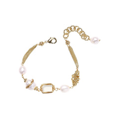 14K gold plated bracelet with freshwater pearls, filigree details, and mixed geometric elements on white background.