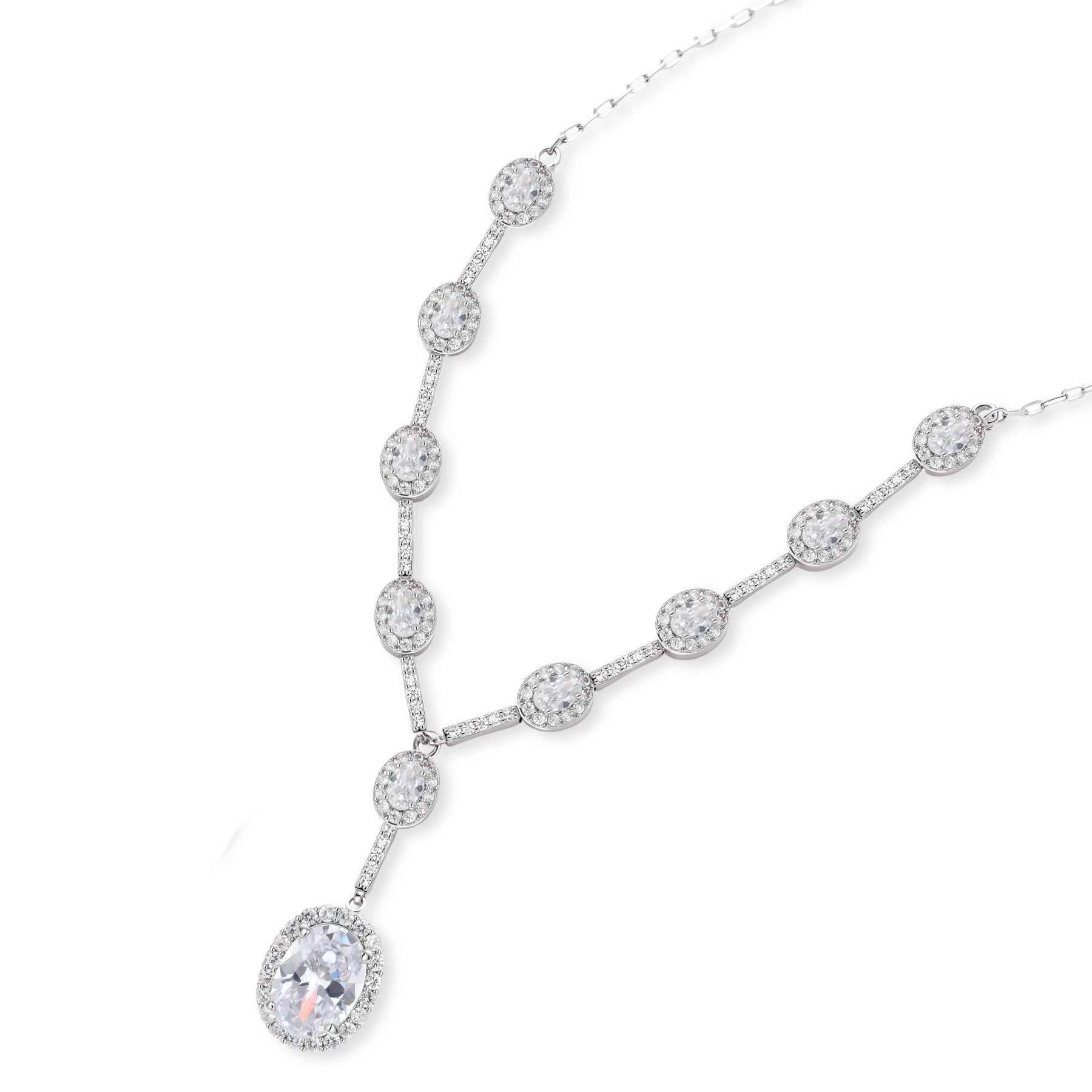 Elegant white gold plated jewelry set with oval cubic zirconia stones in halo settings, featuring Y-necklace and drop earrings.
